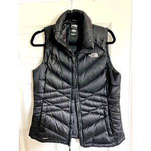North Face women’s black puffer vest; size M